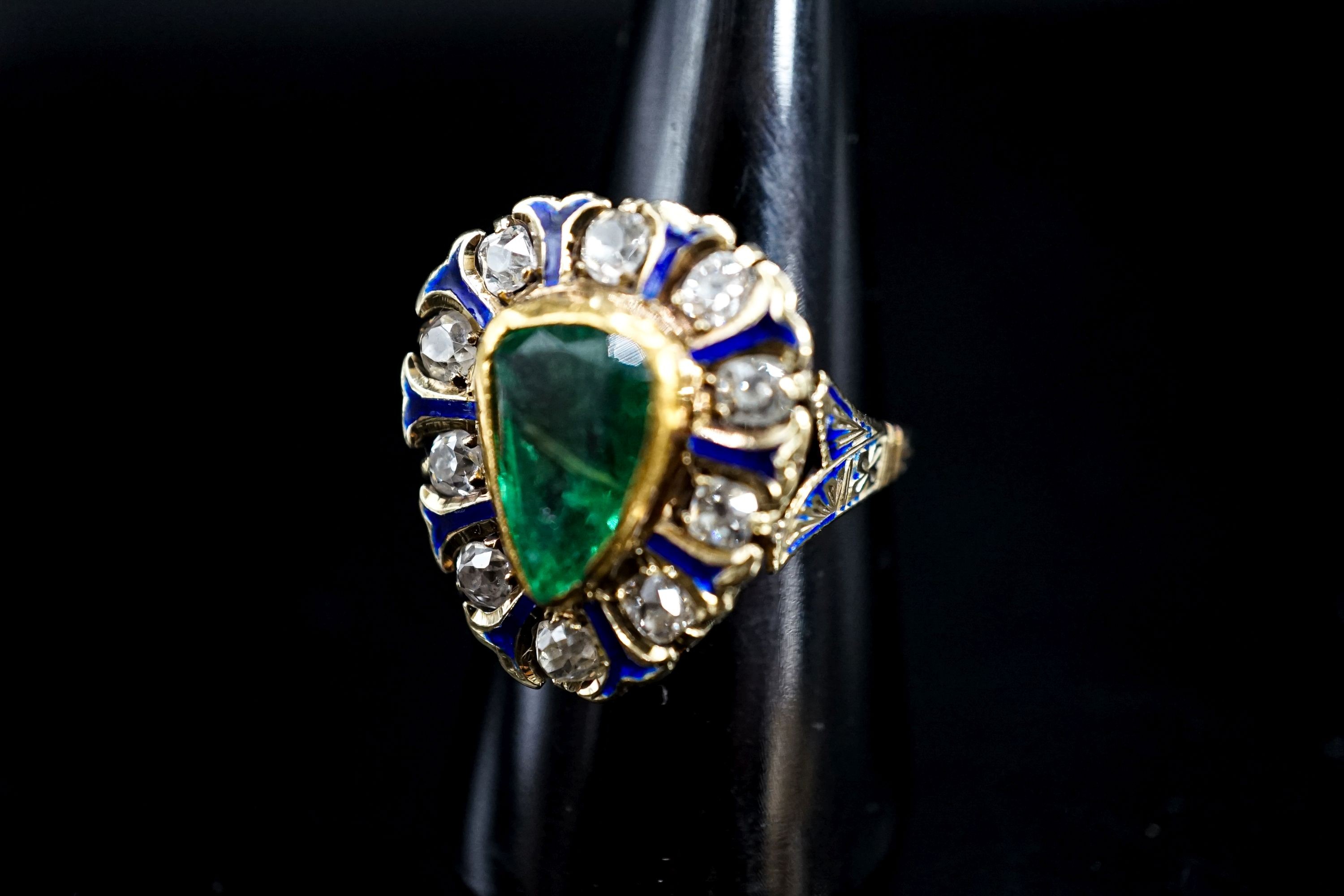 A 14k, emerald, diamond and enamel set pear shaped cluster ring, size Q, gross weight 8.3 grams.